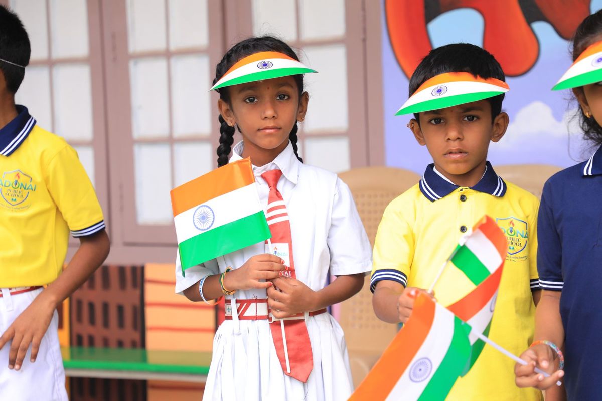 Students holding Indian flags